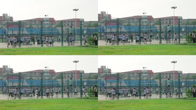 校园中排球场学生在打球