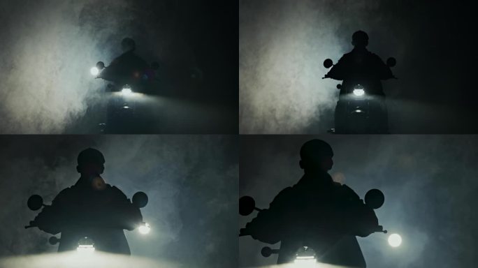 逆光拍摄摩托车从烟雾中出现