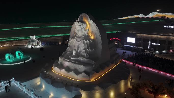 航拍4K哈尔滨冰雪大世界雪雕佛像地藏王菩萨