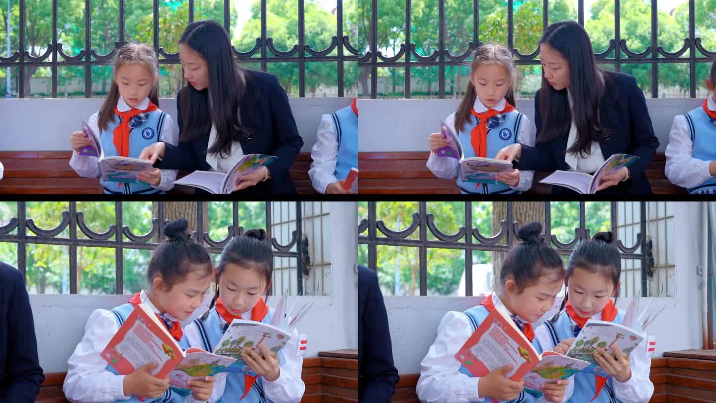 老师与学生在校园看书