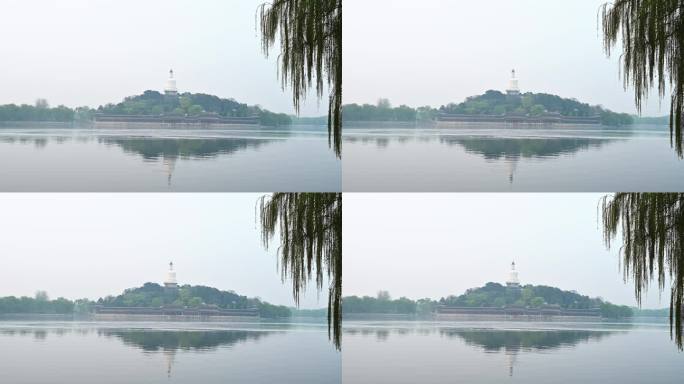 北京北海公园春天湖面晨雾倒影风光