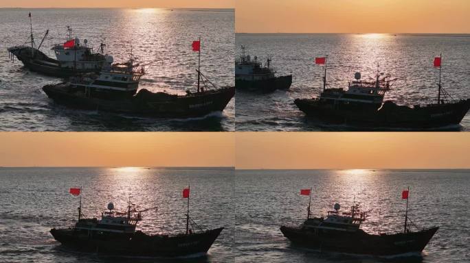 夕阳中波光粼粼的海水中渔船出海航行