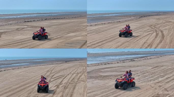 情侣海边沙滩驾驶沙滩摩托