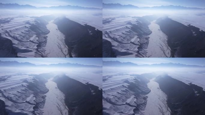 航拍新疆冬季安集海大峡谷迷雾中的雪山峡谷
