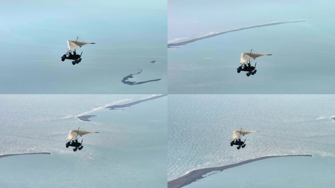 航拍滑翔机海水上空飞翔