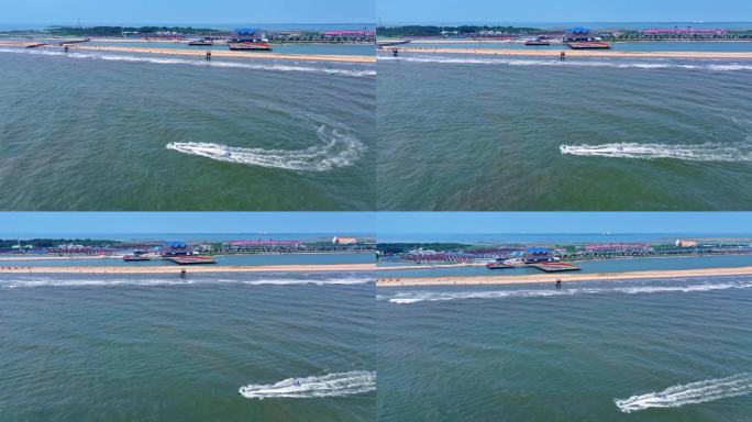 4K航拍海岛海水上游客游玩摩托艇拖拽充气沙发