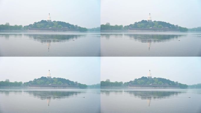 北京北海公园春天湖面晨雾倒影风光