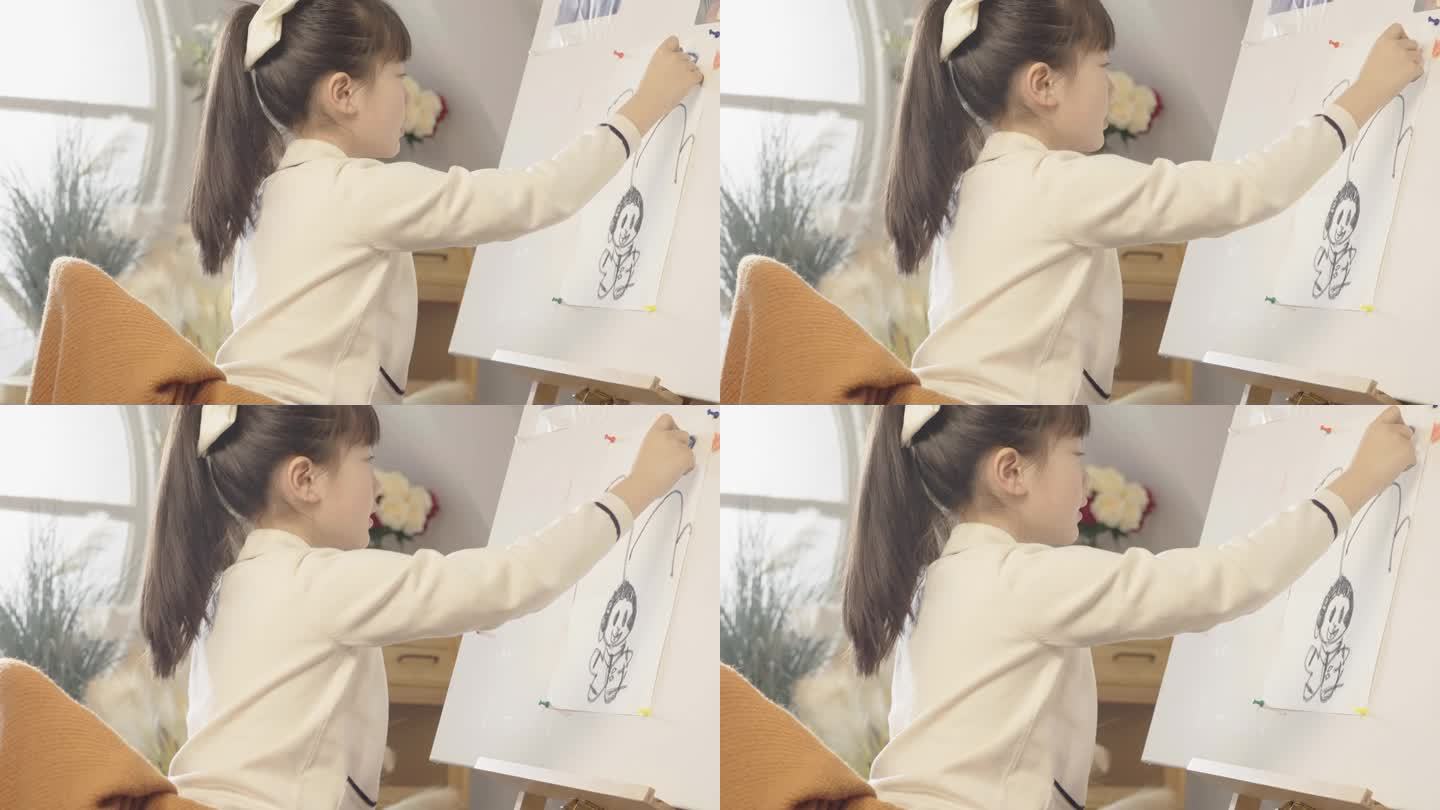 女孩在画板上绘画