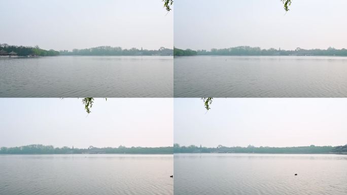 北京北海公园春天湖面晨雾倒影风光