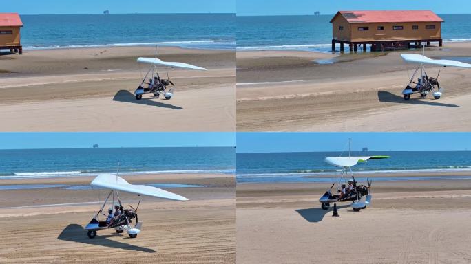 航拍滑翔机在海边沙滩滑行