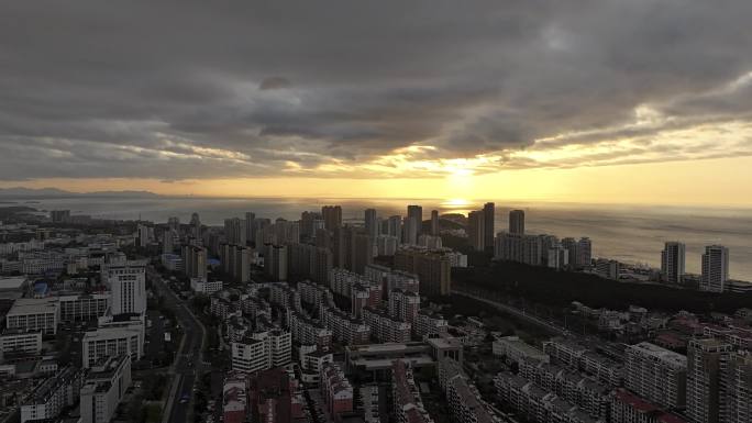 环绕航拍威海高区西海岸城市高楼晚霞天空