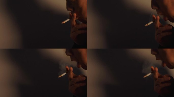男人吸烟吐烟雾