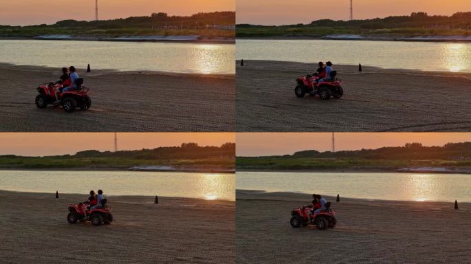 夕阳晚霞一家人海边沙滩体验沙滩摩托