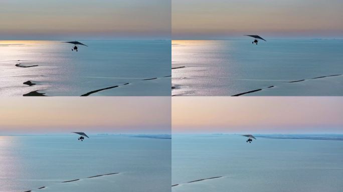 航拍滑翔机载客在月岛海岛上空飞翔剪影