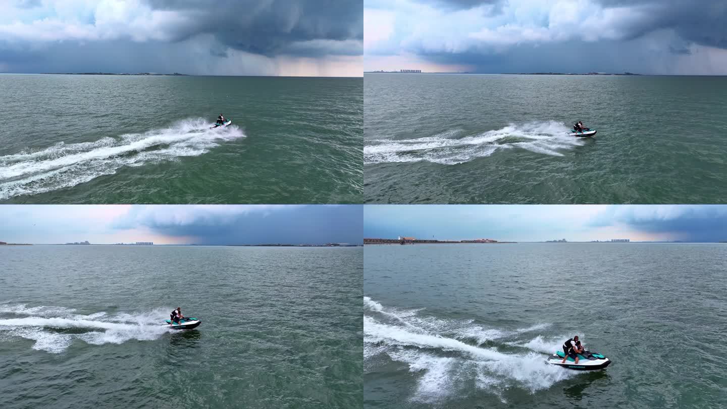 航拍4K游客乘摩托艇海上冲浪