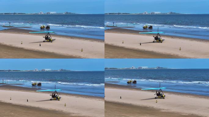 海边沙滩动力三角滑翔机载游客游玩