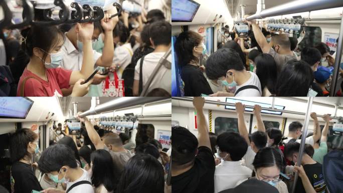 地铁车厢里拥挤的人群