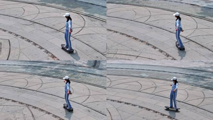 一名年轻美少女在公园广场独自一人练习滑板