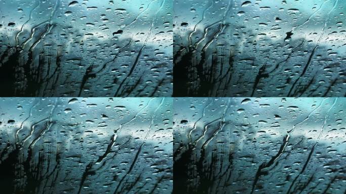 下雨天阴天汽车玻璃上的雨水雨滴