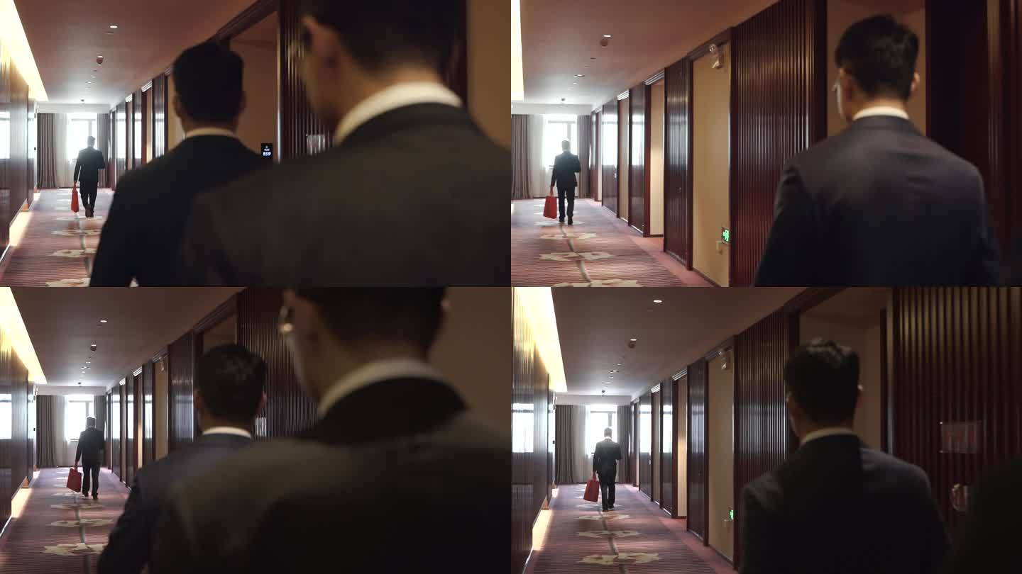 行走在酒店里的男人背影