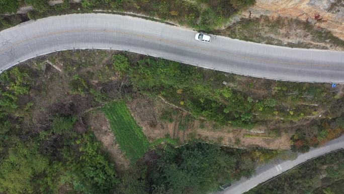 航拍汽车行驶在盘山公路