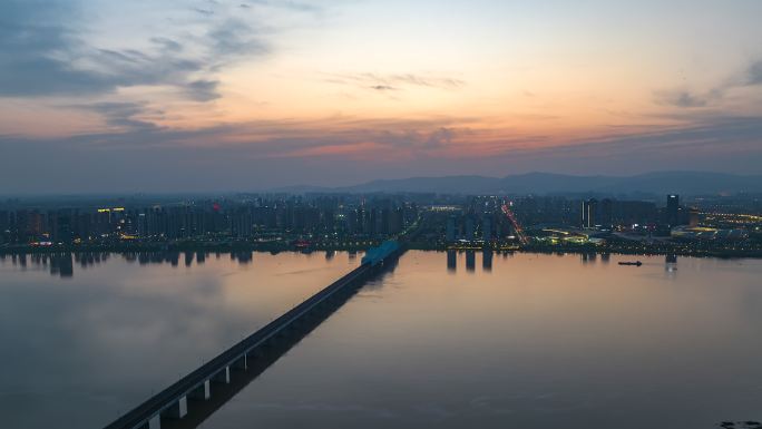 黄昏日落火烧云下的高铁跨江大桥航拍延时