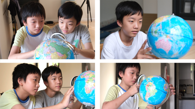 少年儿童使用地球仪