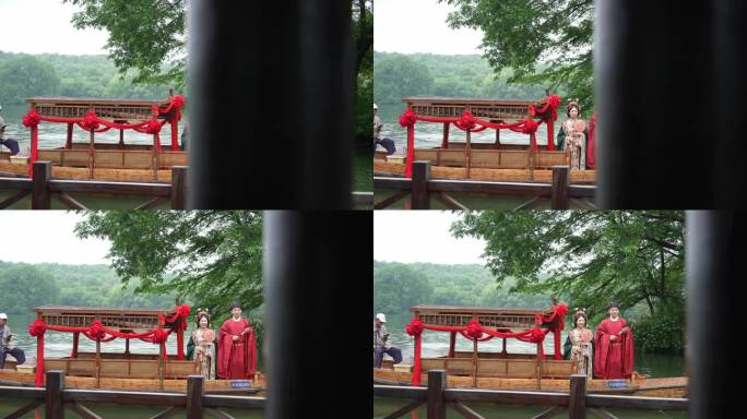 西湖上新郎新娘在手摇船山给中式婚礼