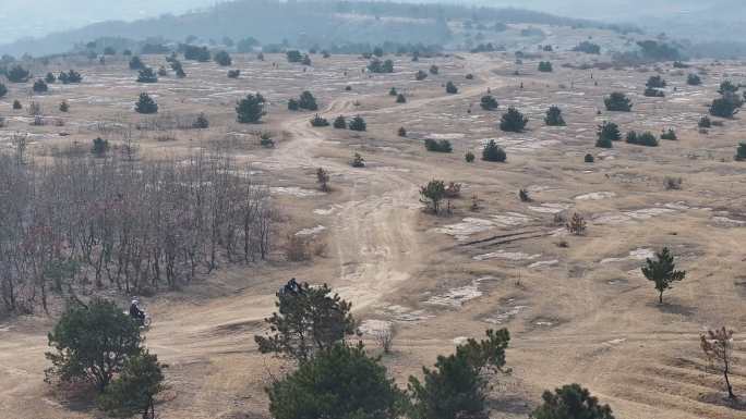 大连市大平山顶冬季摩托车越野航拍素材