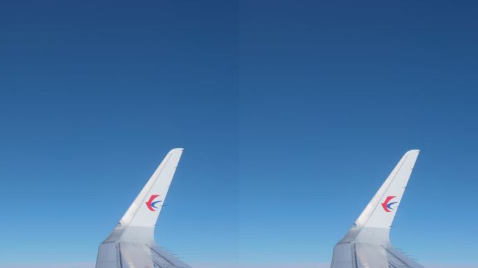 飞机机翼窗外云层