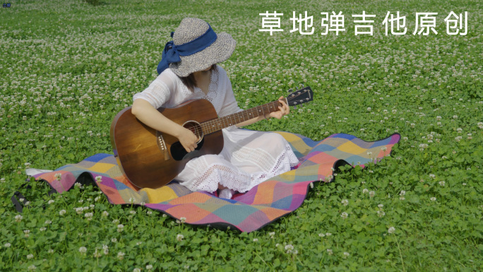 文艺女青年草地弹吉他视频素材
