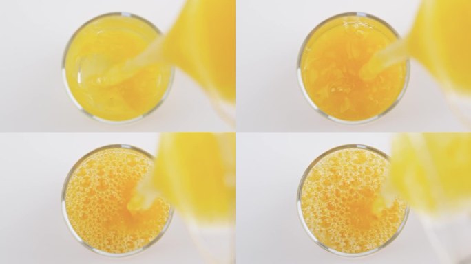 玻璃杯里倒入的新鲜橙汁俯视角度
