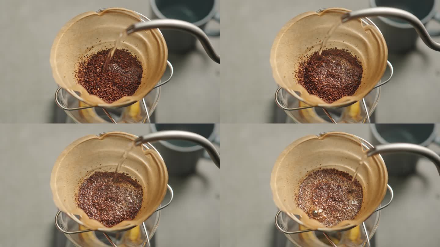 用咖啡壶手冲咖啡滤纸倒热水特写