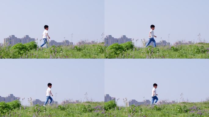 4K小男孩在草地上快乐地奔跑升格慢动作