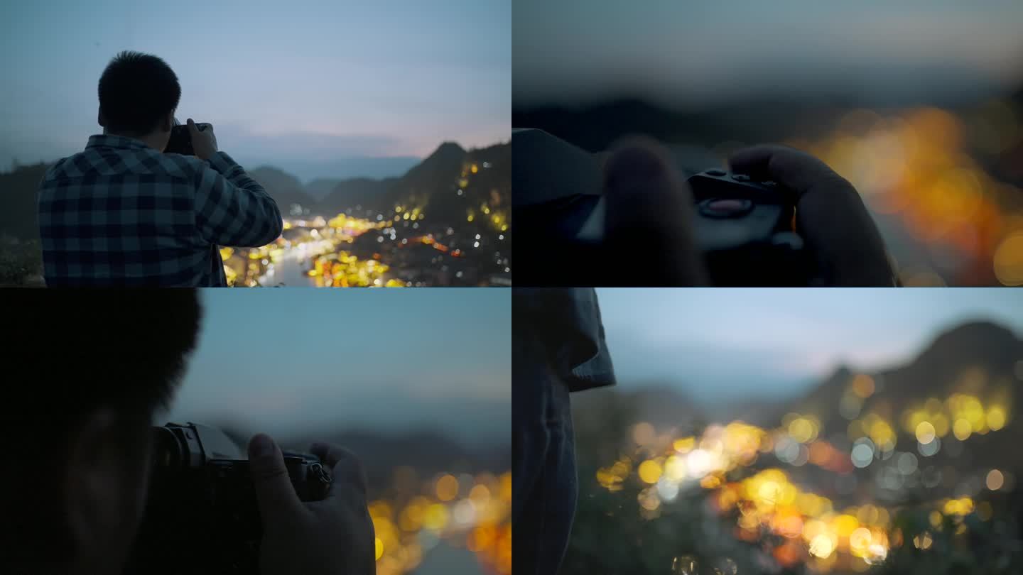 站在山顶拍城市夜景的摄影师