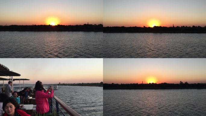 日落时分，埃及卢克索尼罗河游轮看沙漠绿洲