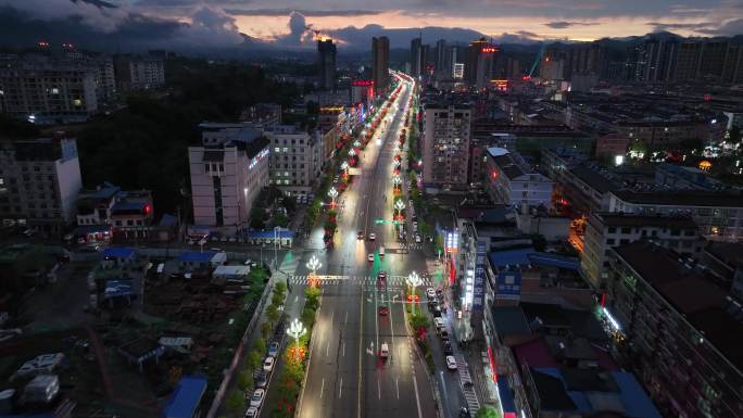 航拍西部城市市区街道车水马龙夜景全貌