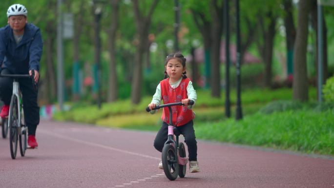 骑车子的女孩 跑步的男人公园玩耍遛娃踏青