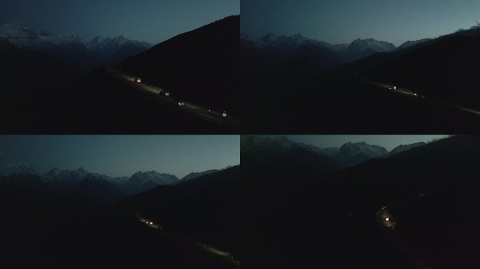 夜晚车辆行驶在高原山路航拍