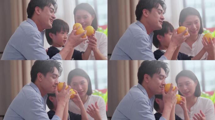 一家人吃橙子