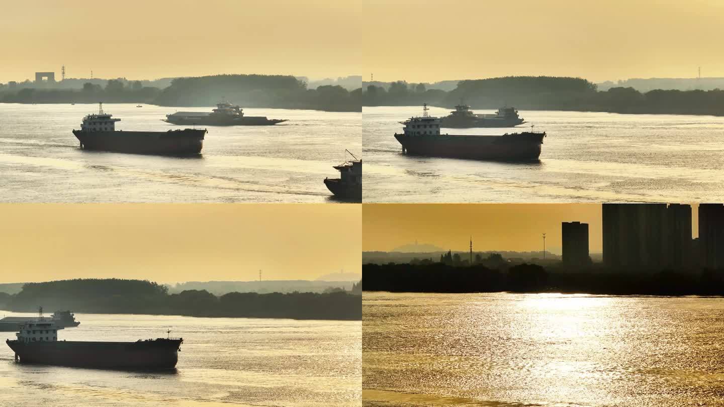航拍长江早晨日出航行运输船只飞鸟水光倒影
