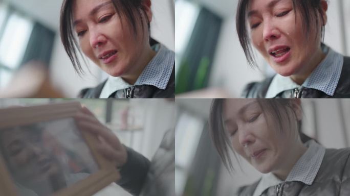 妻子看着照片哭泣
