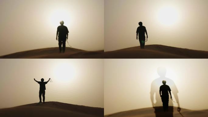 男人沙漠中行走 沙漠人物剪影