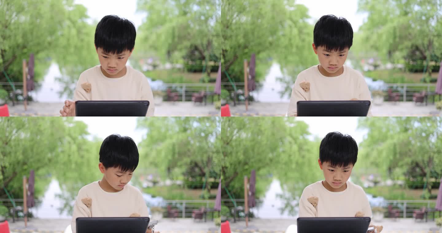 小孩使用平板电脑学习上网课慢镜头