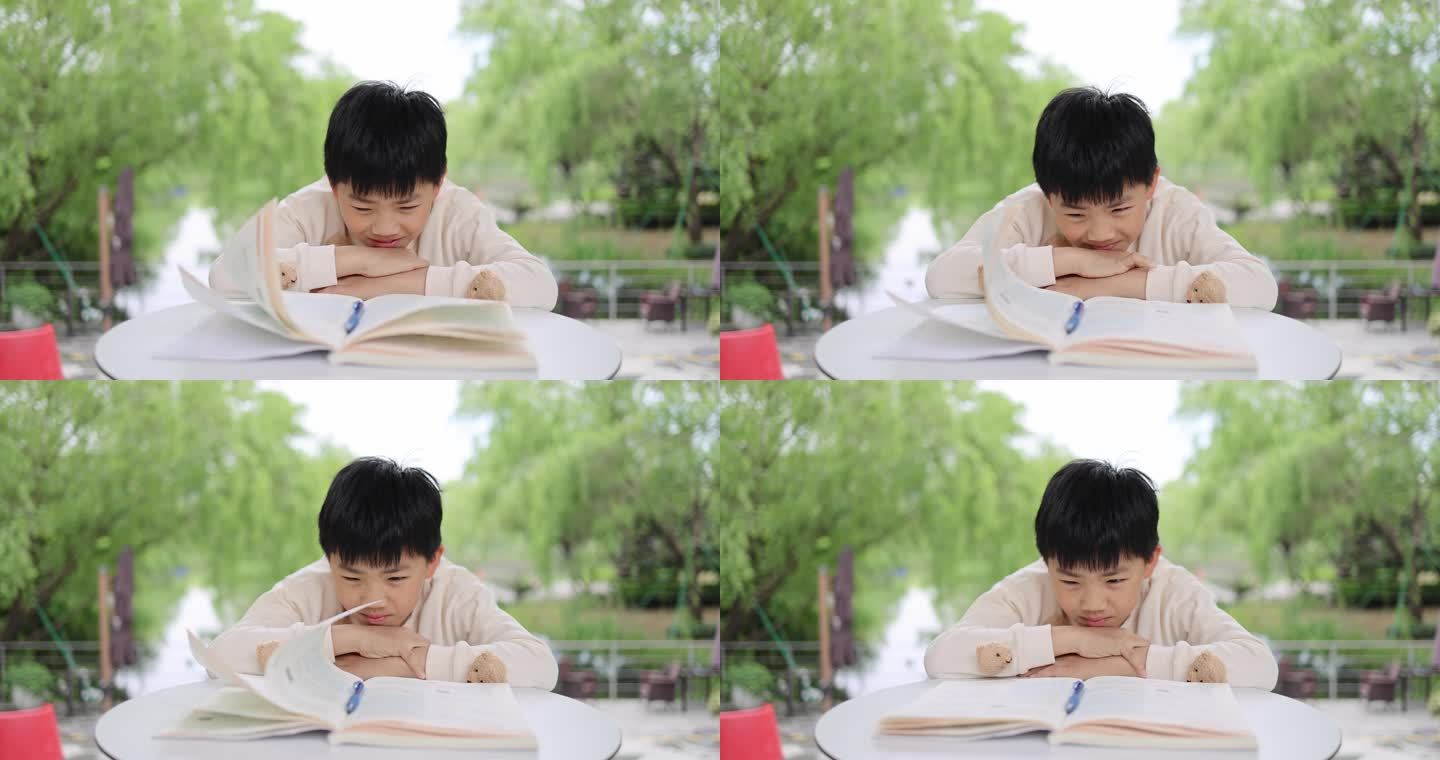 小孩在户外快乐学习写作业慢镜头