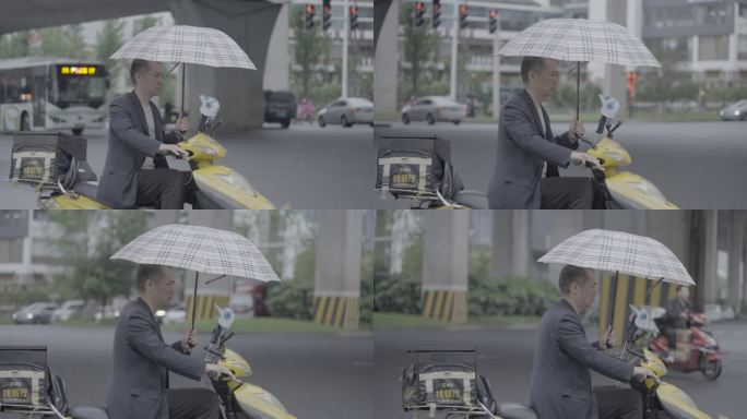 一手打伞一手开车