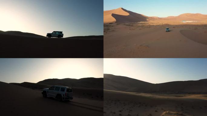 航拍汽车行驶在巴丹吉林沙漠孤独勇敢向前