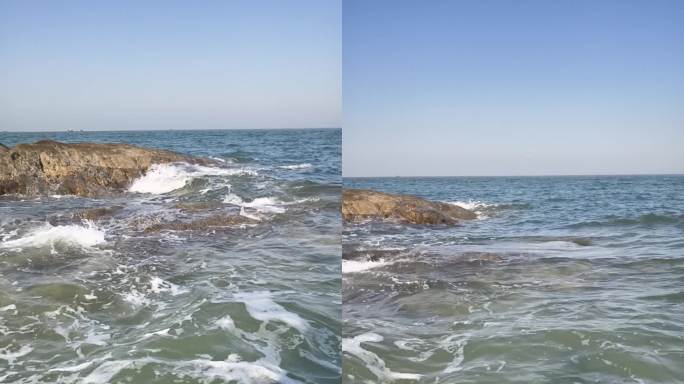 海水拍打岸边岩石激起波浪 慢动作 竖屏
