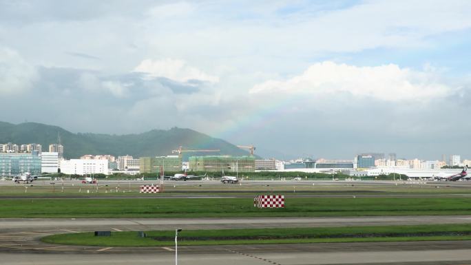 机场停机坪雨后彩虹飞机滑行
