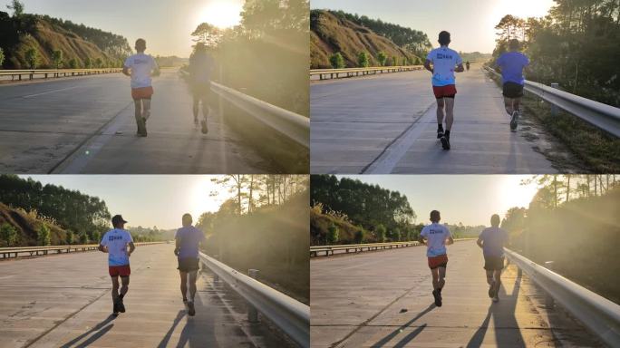 逆光晨跑的男子逆光晨阳道路上跑步慢跑速度